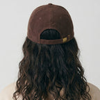dissociating corduroy hat.